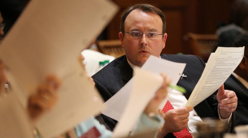 March 22, 2016 Atlanta: Rep. Scot Turner (R-Holly Springs) looks over legislation as the 39th day of the 2016 Legislative session continues into Tuesday night March 22, 2016. Ben Gray / bgray@ajc.com