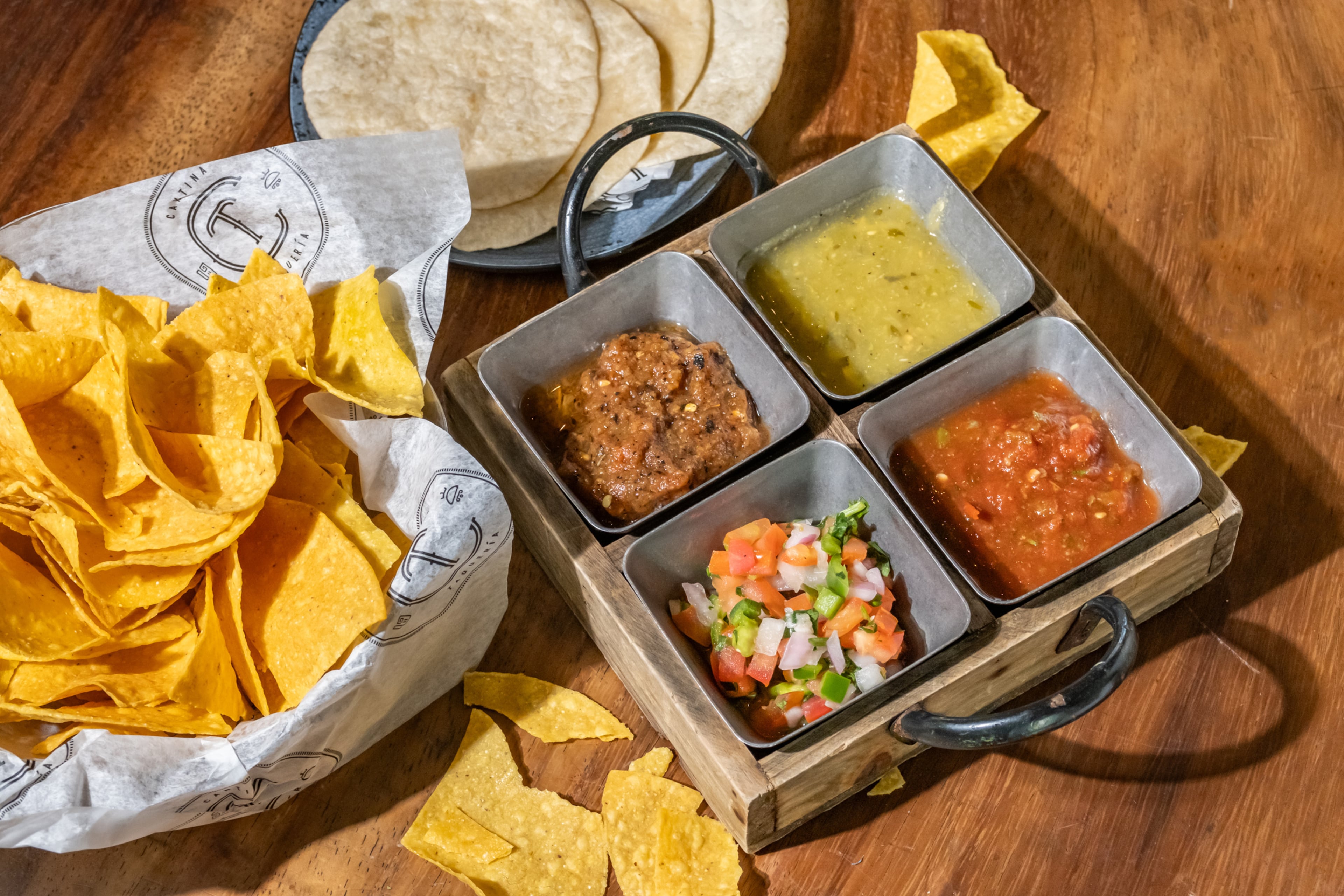 Each table of customers at CT Cantina is greeted with a complimentary selection of four salsas and tortilla chips made in-house. (Courtesy of CT Cantina & Taqueria)