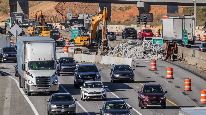 Work on the new I-285 interchange at Ga. 400 will continue into 2024. (File photo by John Spink / John.Spink@ajc.com)