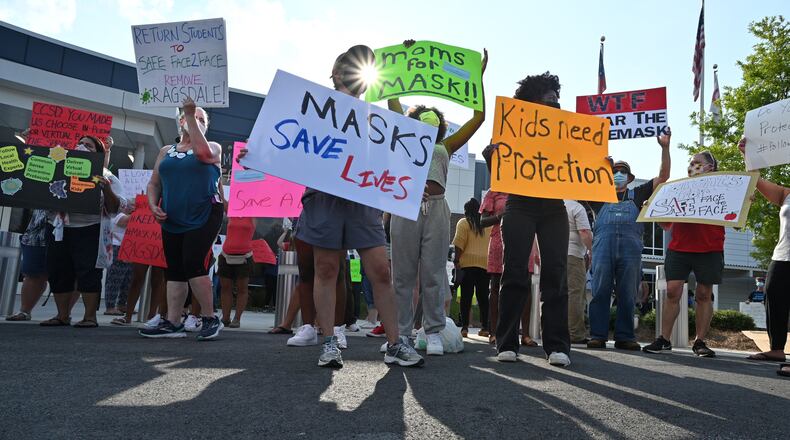 August 12, 2021 Marietta - Parents hold a rally to encourage the Cobb County School District to require masks for students and staff at the parking lot of Cobb County School District on Thursday, August 12, 2021. Parents hold a rally to encourage the Cobb County School District to require masks for students and staff. Cobb County schools began the 2021-22 school year with a rule that made mask wearing optional for students and staff. (Hyosub Shin / Hyosub.Shin@ajc.com)