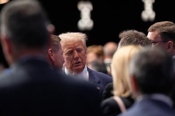 President Donald Trump shakes hands as he arrives for a plenary session at the NATO summit in The Hague, Netherlands, Wednesday, June 25, 2025. (AP Photo/Alex Brandon)