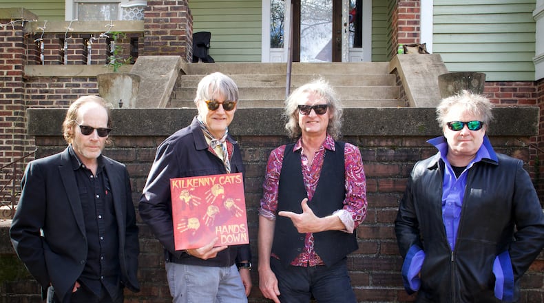 A 2023 photo of Athens-formed band Kilkenny Cats holding a copy of their "Hands Down" album on Barber Street in Athens. Left to right: Sean O'Brien, Tom Cheek, Allen Wagner and Keith Landers. Courtesy of Karen Allison / Propeller Sound Recordings.