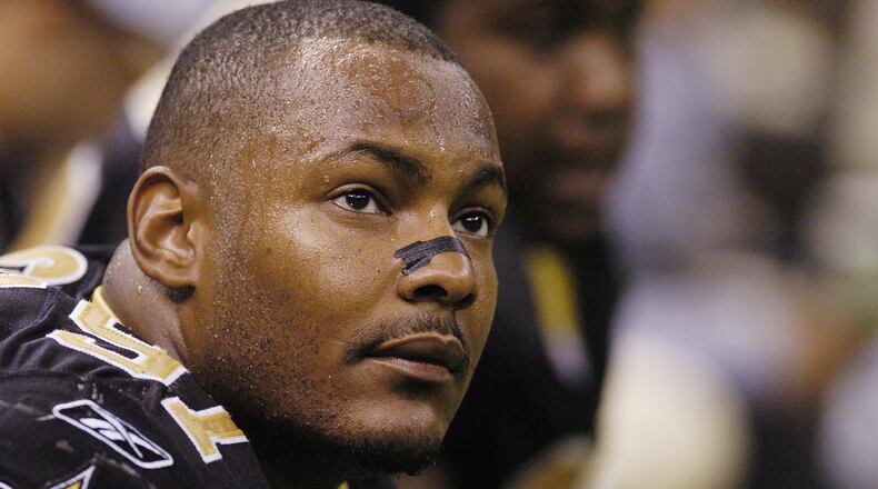 NEW ORLEANS - OCTOBER 10: Defensive end Will Smith #91 of the New Orleans Saints sits on the sideline on the field during the game against the Tampa Bay Buccaneers on Sunday October 10, 2004 at the Superdome in New Orleans, Louisiana. The Buccaneers defeated the Saints 20-17. (Photo by Chris Graythen/Getty Images)