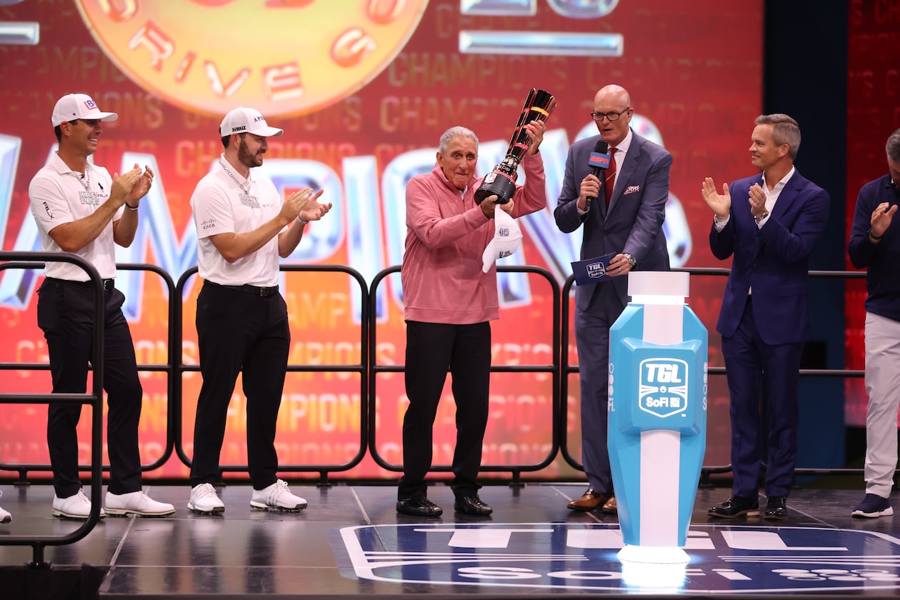 Team owner Arthur Blank holds the SoFi Cup after his Atlanta Drive won the first TGL Championship, March 25, 2025. (Atlanta Drive photo)