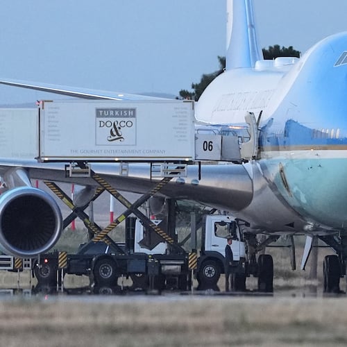 Catering trucks are parked at Air Force One on the tarmac as the motorcade carrying U.S. President Donald Trump arrives to depart following the NATO summit at Ankara International Airport in Ankara, Turkey, Wednesday, July 8, 2026. (AP Photo/Alex Brandon)