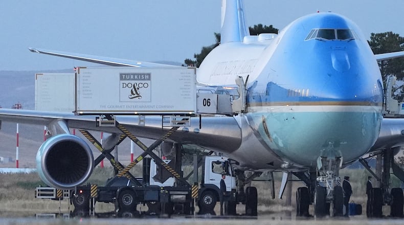 Catering trucks are parked at Air Force One on the tarmac as the motorcade carrying U.S. President Donald Trump arrives to depart following the NATO summit at Ankara International Airport in Ankara, Turkey, Wednesday, July 8, 2026. (AP Photo/Alex Brandon)