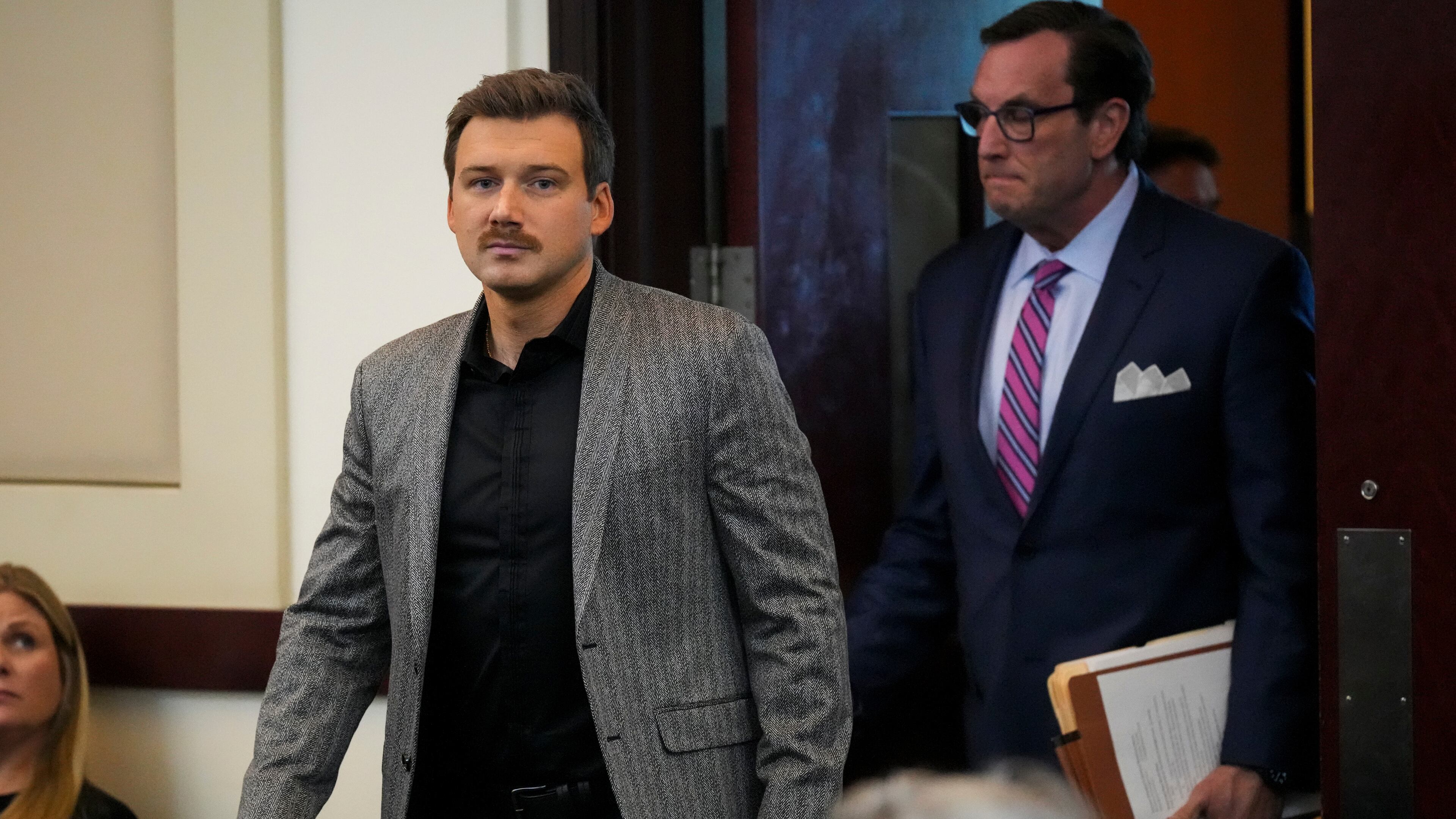 FILE - Morgan Wallen, left, appears in court to plead guilty to reckless endangerment charges related to throwing a chair off a six-story balcony Thursday, Dec. 12, 2024, in Nashville, Tenn. (AP Photo/George Walker IV, File)