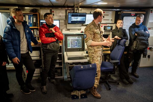 Denmark's Prime Minister Mette Frederiksen and her husband Bo Tengberg aboard the Danish Navy inspection vessel Vaedderen together with Greenland's acting head of government Múte Bourup Egede, center left, and newly elected head of government, Jens-Frederik Nielsen, left, in the waters around Nuuk, Greenland, Thursday, April 3, 2025. (Mads Claus Rasmussen/Ritzau Scanpix via AP)