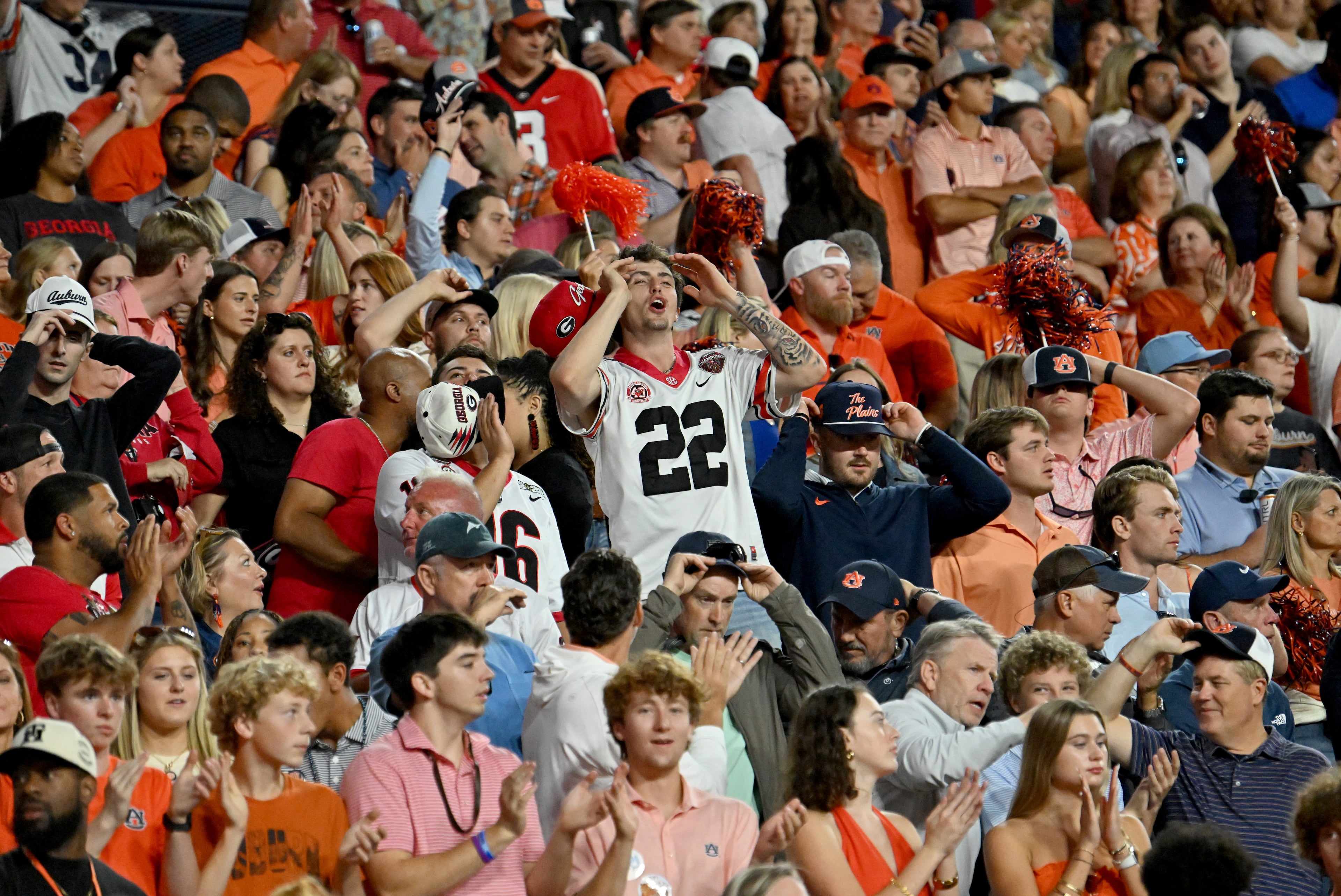 Football fans react during the first half in a NCAA college football game at Jordan-Hare Stadium, Saturday, October 11, 2025, in Auburn, Ala. The play was under review. It was not a touchdown. (Hyosub Shin / AJC)
