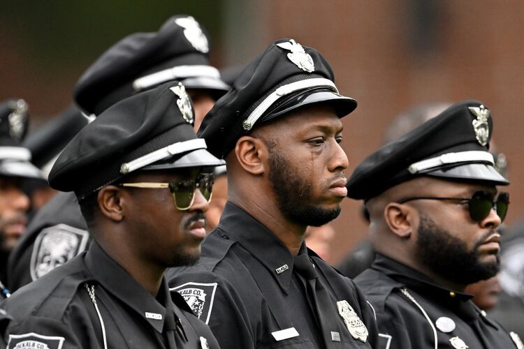 A DeKalb County police officer can’t hide his emotional during the Final Honors following the memorial service for DeKalb County police Officer David Rose, who was killed while responding to the Aug. 8 shooting at the CDC, outside the First Baptist Church Atlanta, Friday, August 22, 2025, in Atlanta. Hyosub Shin / AJC)