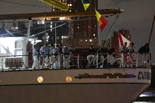 Crew members aboard the Cuauhtémoc, a masted Mexican Navy training ship, gather on deck after the ship collided with the Brooklyn Bridge, Saturday, May 17, 2025, in New York. (AP Photo/Yuki Iwamura)
