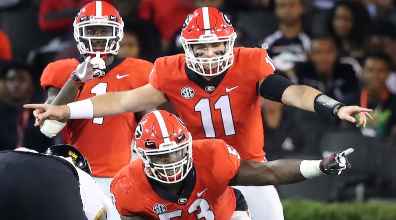 October 14, 2017 Athens: Georgia quarterback Jake Fromm and center Lamont Gaillard call the offensive adjustments againt Missouri during the first half in a NCAA college football game on Saturday, October 14, 2017, in Athens.   Curtis Compton/ccompton@ajc.com