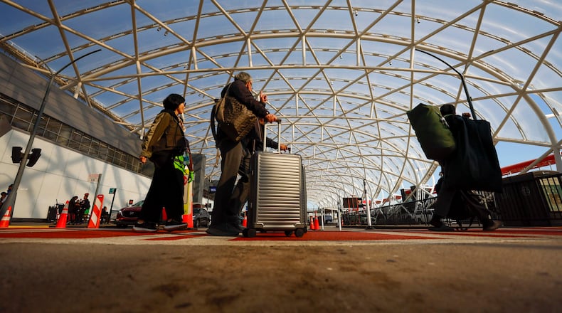 Travelers are departing from Hartsfield-Jackson Atlanta International Airport on Thursday, Nov. 6, 2025. Atlanta is one of the airports where the FAA will cut flights because of the shutdown, and airports are experiencing a shortage of air traffic controllers. (Miguel Martinez/AJC)