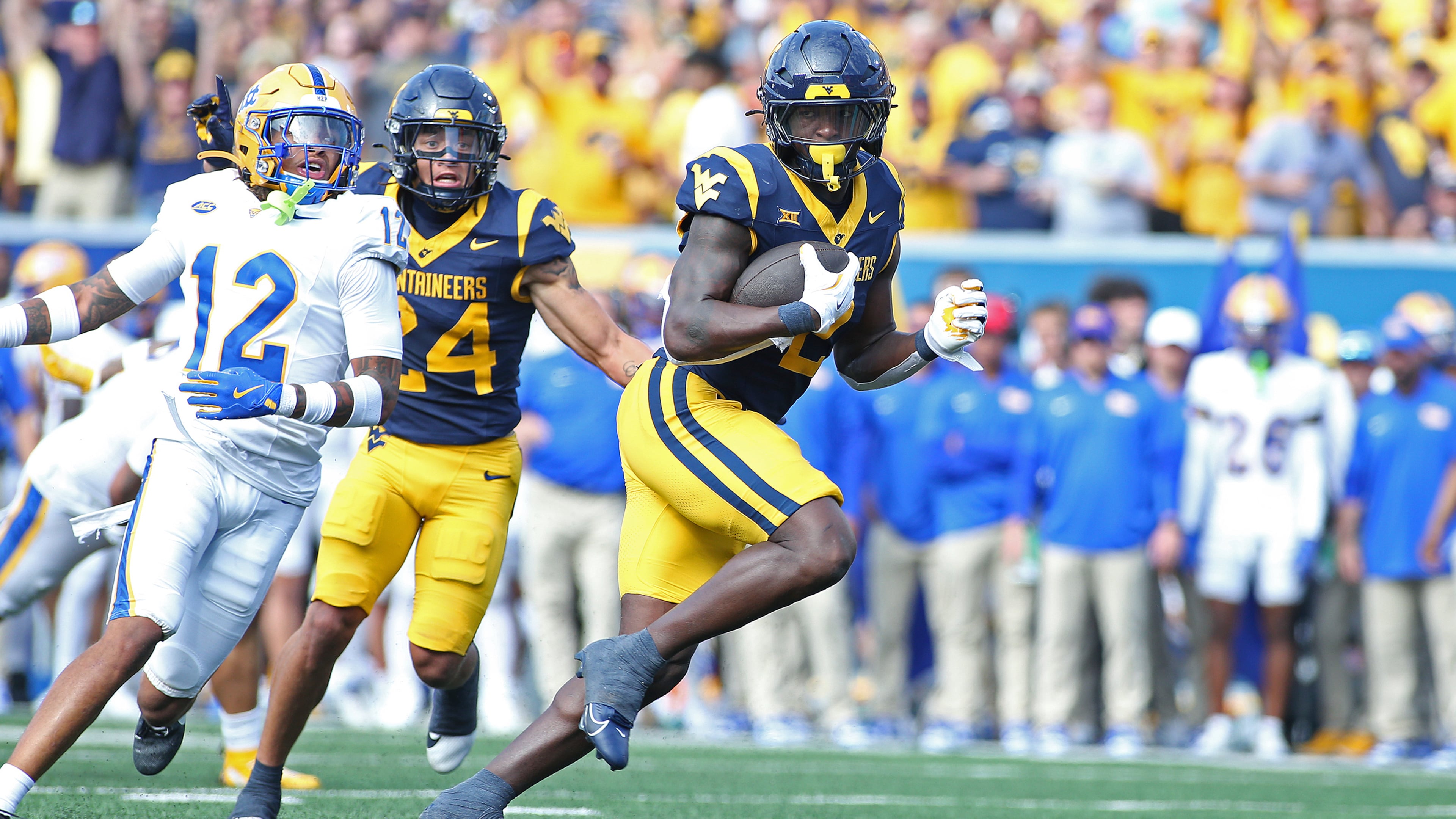 West Virginia Mountaineers running back Tye Edwards (2) runs it in for a touchdown during the first half of an NCAA college football game against Pittsburgh Saturday, Sept. 13, 2025, in Morgantown, W.Va. (AP Photo/Kathleen Batten)
