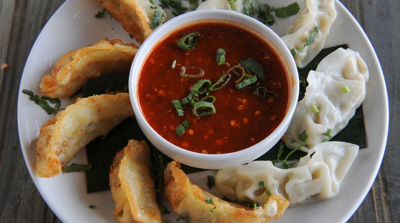 Momo - steamed and/or fried dumplings stuffed with choice of vegetables or chicken -- at Masti. / AJC file photo