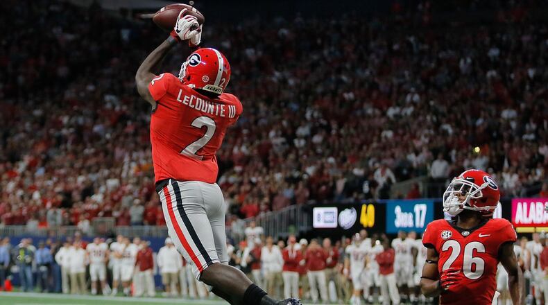 Georgia defensive back Richard LeCounte (2) intercepts a pass by Alabama quarterback Tua Tagovailoa (13) in the end zone in the SEC Championship game Saturday, Dec. 1, 2018, at Mercedes-Benz  Stadium in Atlanta.  BOB ANDRES / BANDRES@AJC.COM