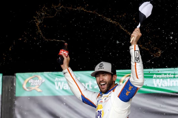 Driver Chase Elliott celebrates in Victory Lane after winning a NASCAR Cup Series auto race, Saturday, June 28, 2025, in Hampton, Ga. (AP Photo/Butch Dill)