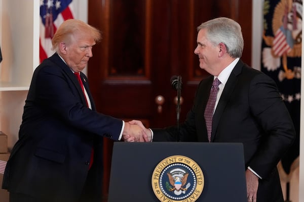President Donald Trump shakes hands with Chairman and CEO of GE Aerospace Larry Cup Jr. during an event about investing in America in the Cross Hall of the White House, Wednesday, April 30, 2025, in Washington. (AP Photo/Alex Brandon)