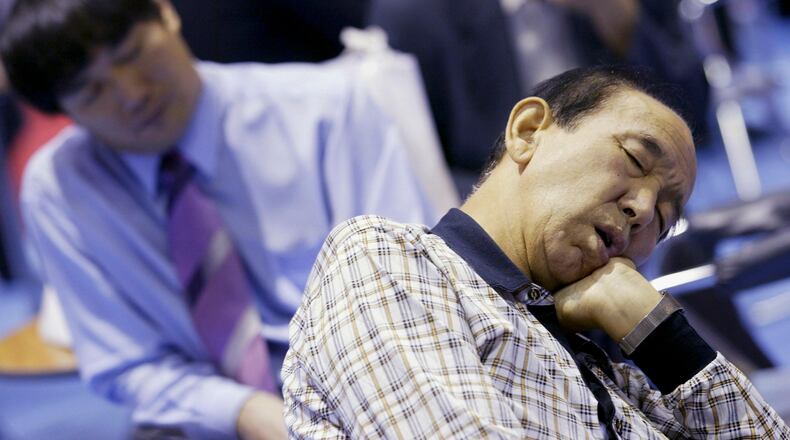 SEOUL, SOUTH KOREA - SEPTEMBER 23: Elderly South Korean job seekers sleep during an elderly persons' job fair on September 23, 2005 in Seoul, South Korea. When the percentage of those aged 65 or older to the total population is greater than 7%, the population is called an Ageing Society. South Korea has the world's fastest ageing population which could signal a death knell for South Korea's economic progress. (Photo by Chung Sung-Jun/Getty Images)