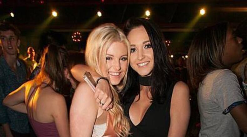 Ladies pose for a picture during a night in Gold Room.