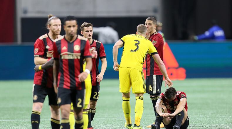 A Columbus Crew player tries to console Atlanta United's   Julian Gressel after the game.