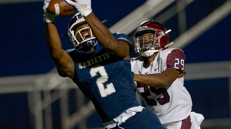 St. Joseph corner back Keenan Nelson Jr. (29) closes in as Marietta wide receiver Arik Gilbert (2) reaches out for a pass in the second half of Friday's game. (Daniel Varnado/Special)