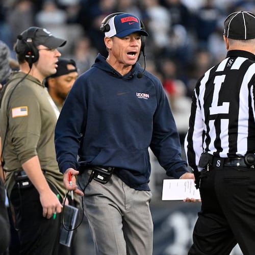 UConn head coach Jim Mora talks with an official during the first half of an NCAA college football game against Duke, Saturday, Nov. 8, 2025, in East Hartford, Conn. (AP Photo/Jessica Hill)