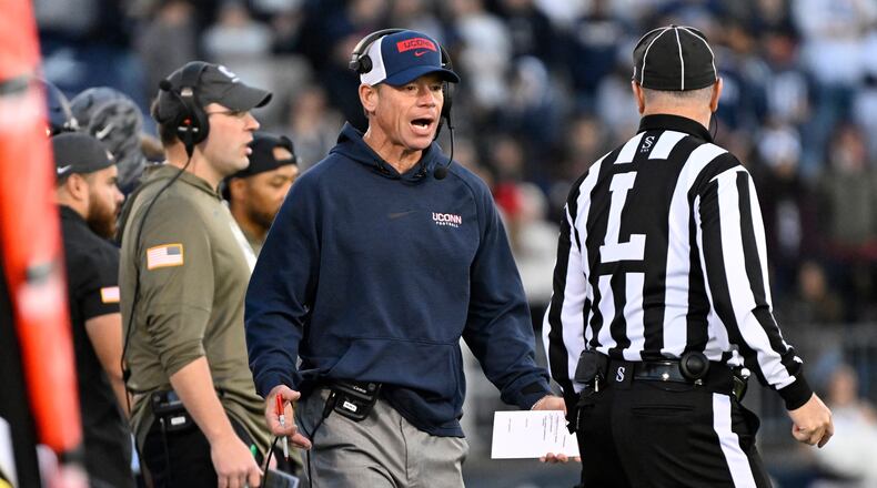 UConn head coach Jim Mora talks with an official during the first half of an NCAA college football game against Duke, Saturday, Nov. 8, 2025, in East Hartford, Conn. (AP Photo/Jessica Hill)