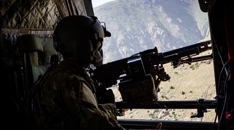 This June 9, 2017 photo released by Operation Resolite Support shows a U.S. Army CH-47 Chinook helicopter crew chief assigned to Task Force Flying Dragons, 16th Combat Aviation Brigade, 7th Infantry Division scans below near Mazar-e-Sharif, Afghanistan. Sixteen years into its longest war, the United States is sending another 4,000 troops to Afghanistan in an attempt to turn around a conflict characterized by some of the worst violence since the Taliban were ousted in 2001. They are also facing the emergence of an Islamic State group affiliate and an emboldened Taliban, who by Washington's own watchdog's assessment now control nearly half of Afghanistan.