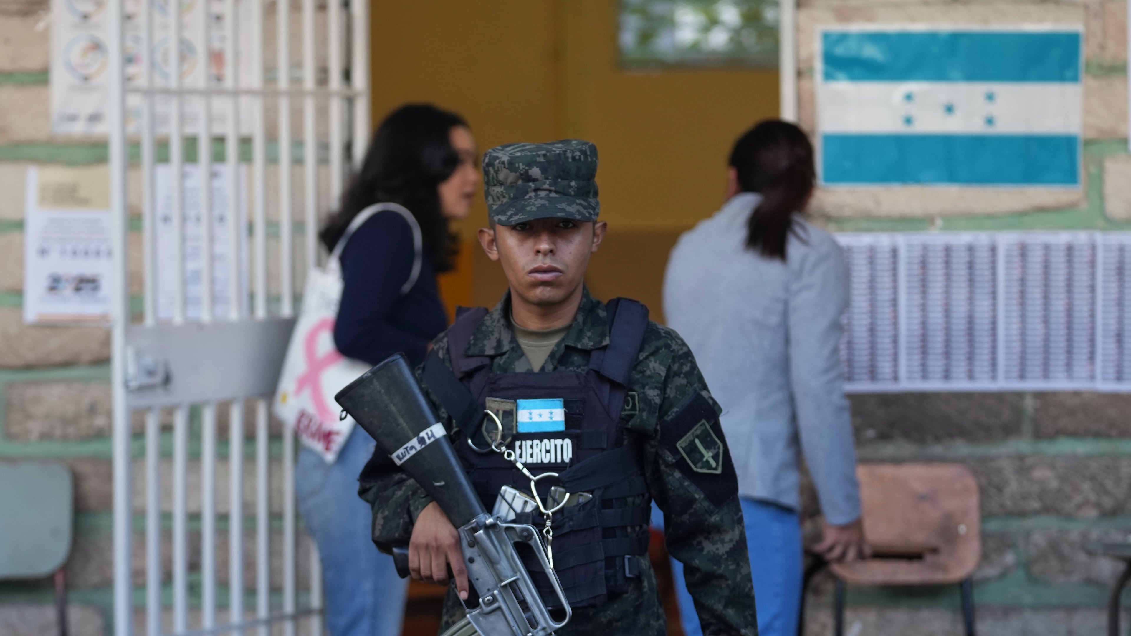 A soldier guards a polling station during general elections in Tegucigalpa, Honduras, Sunday, Nov. 30, 2025. (AP Photo/Moises Castillo)