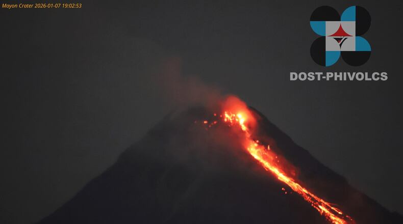 In this photo provided by the Philippine Institute of Volcanology and Seismology, lava flows from the crater of the Mayon volcano as alert level 3 remains raised in Albay province, north eastern Philippines on Wednesday Jan. 7, 2026. (Philippine Institute of Volcanology and Seismology via AP)