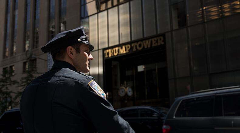 A New York City Police (NYPD) officer patrols across the street from Trump Tower, May 4, 2017 in New York City. President Donald Trump is returning to New York on Thursday for the first time since taking office and several protests are planned throughout the city.