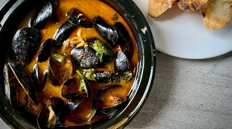 Deviled mussels from the Lawrence in Midtown pack a wallop of flavor you don't often find with this simple shellfish. Henri Hollis/henri.hollis@ajc.com