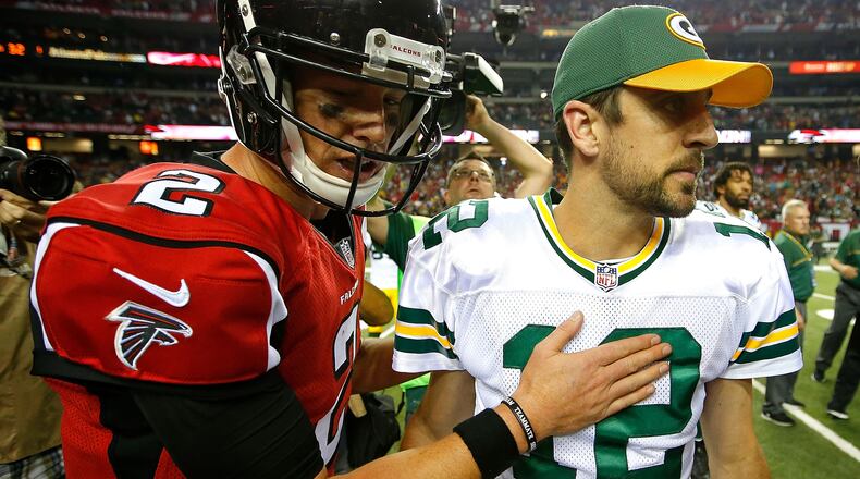 Falcons quarterback Matt Ryan meets Packers quarterback Aaron Rodgers at midfield after the Falcons defeated the Packers, 33-32, at the Georgia Dome on Oct. 30, 2016, in Atlanta.