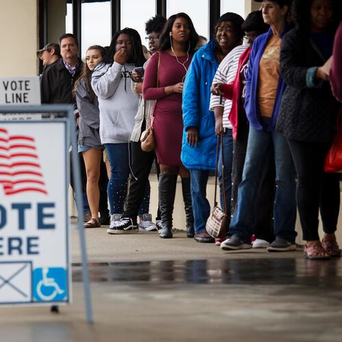 People wait in line during the last day of early voting at the Westgate Shopping Center on Nov. 2, 2018, in Macon. True the Vote facilitated over 250,000 voter challenges, exploiting a Georgia law that lets any resident challenge an unlimited number of their neighbors’ right to vote, Lauren Groh-Wargo writes. (Ruth Fremson/The New York Times 2018)