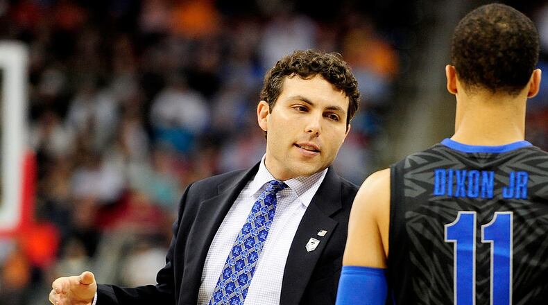 RALEIGH, NC - MARCH 23: Head coach Josh Pastner of the Memphis Tigers talks to Michael Dixon Jr. #11 in the first half against the Virginia Cavaliers during the third round of the 2014 NCAA Men's Basketball Tournament at PNC Arena on March 23, 2014 in Raleigh, North Carolina. (Photo by Grant Halverson/Getty Images)
