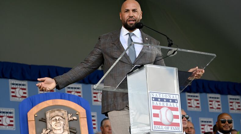 Carlos Beltrán speaks after being inducted into the National Baseball Hall of Fame during the 2026 National Baseball Hall of Fame Induction Ceremony at the Clark Sports Center on Sunday, July 26, 2026, in Cooperstown, N.Y. Braves centerfielder Andruw Jones is set for induction into the National Baseball Hall of Fame as part of the Class of 2026, alongside Carlos Beltrán and Jeff Kent. (Hyosub Shin/AJC)