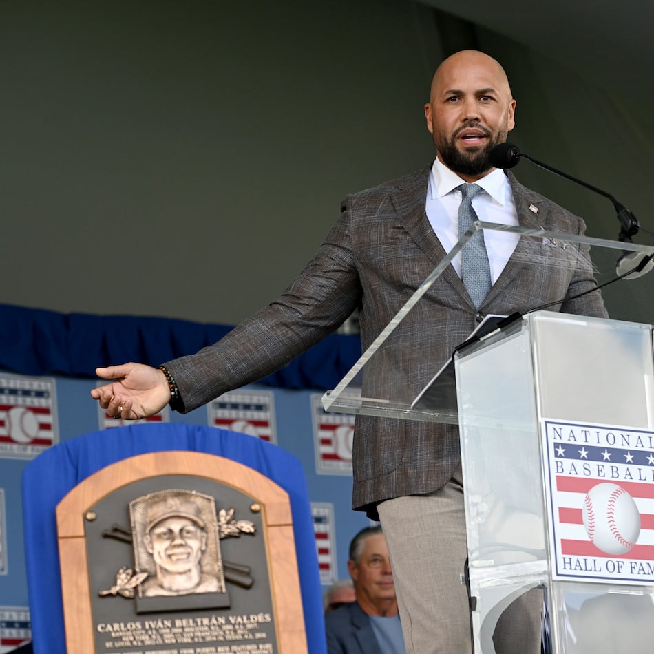 Carlos Beltrán speaks after being inducted into the National Baseball Hall of Fame during the 2026 National Baseball Hall of Fame Induction Ceremony at the Clark Sports Center on Sunday, July 26, 2026, in Cooperstown, N.Y. Braves centerfielder Andruw Jones is set for induction into the National Baseball Hall of Fame as part of the Class of 2026, alongside Carlos Beltrán and Jeff Kent. (Hyosub Shin/AJC)