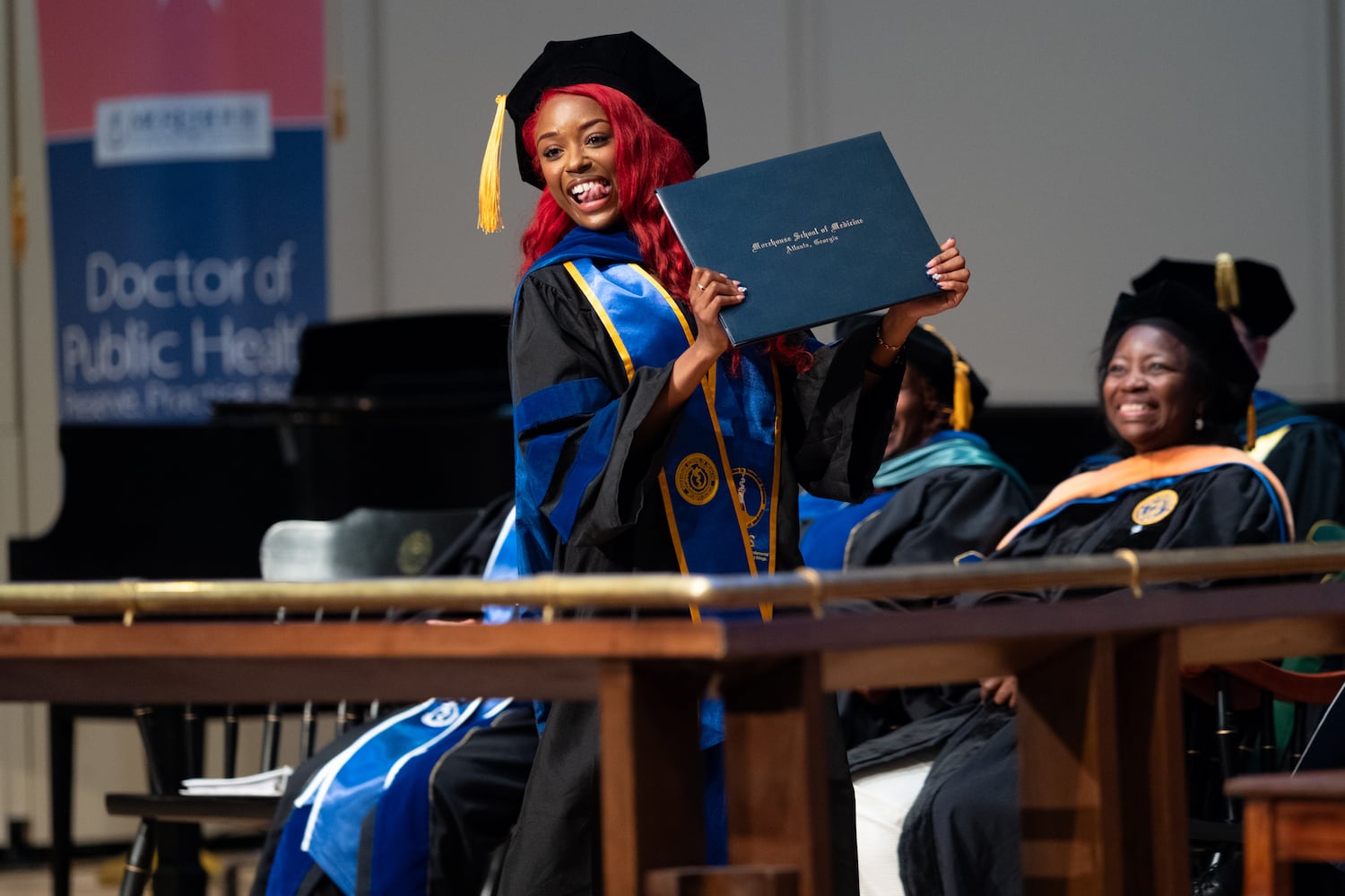 Dr. Aliyah Anderson celebrates after receiving her diploma for a Ph.D. in Biomedical Sciences at the Morehouse School of Medicine graduation on Saturday, May 16, 2026, in Atlanta. (Ben Gray for the AJC)