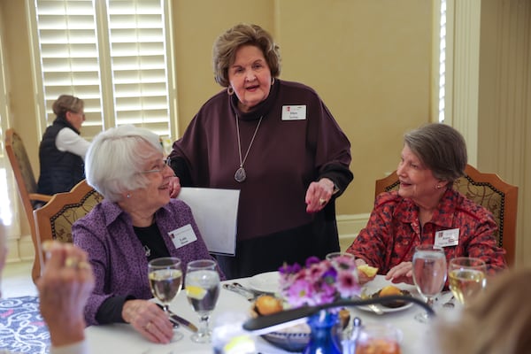 Organizer Ellen Sutley (center) greets women meeting at the JULIET’s (Just Us Ladies Indulging in Eating Together) dining club at Park Springs retirement community in Stone Mountain on Tuesday, Feb. 17, 2026. (Arvin Temkar/AJC)