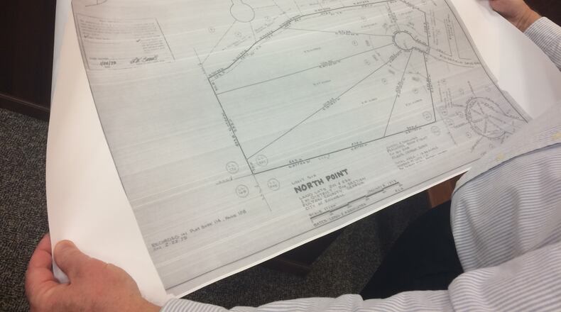 Mike Hartley, North Point resident, pointed to property plans from 1979 at a Roswell Planning Commission meeting. He opposes a proposed development in the neighborhood.