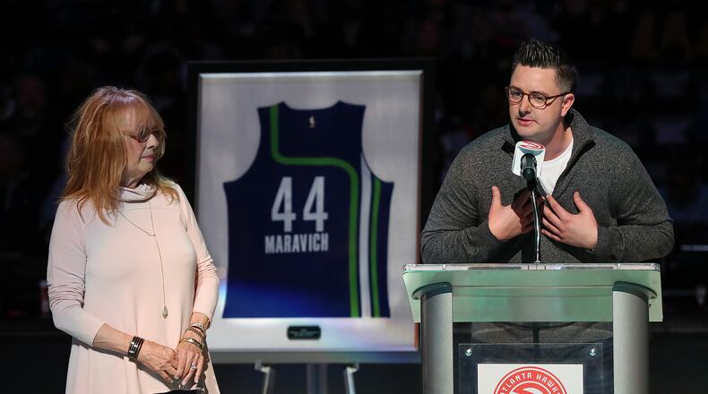 Pete Maravich's wife Jackie looks on while their son Josh speaks as Pete's No. 44 Hawks jersey is retired in a halftime ceremony of a Hawks game at Philips Arena on Friday, March 3, 2017, in Atlanta. Curtis Compton/ccompton@ajc.com
