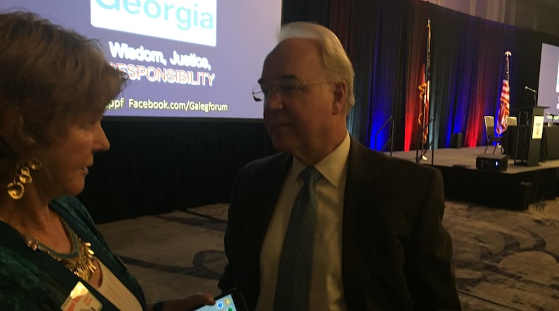 Tom Price, a former congressman and U.S. secretary of health and human services, speaks to audience members after a panel discussion on Medicaid that the Georgia Public Policy Foundation hosted Friday.