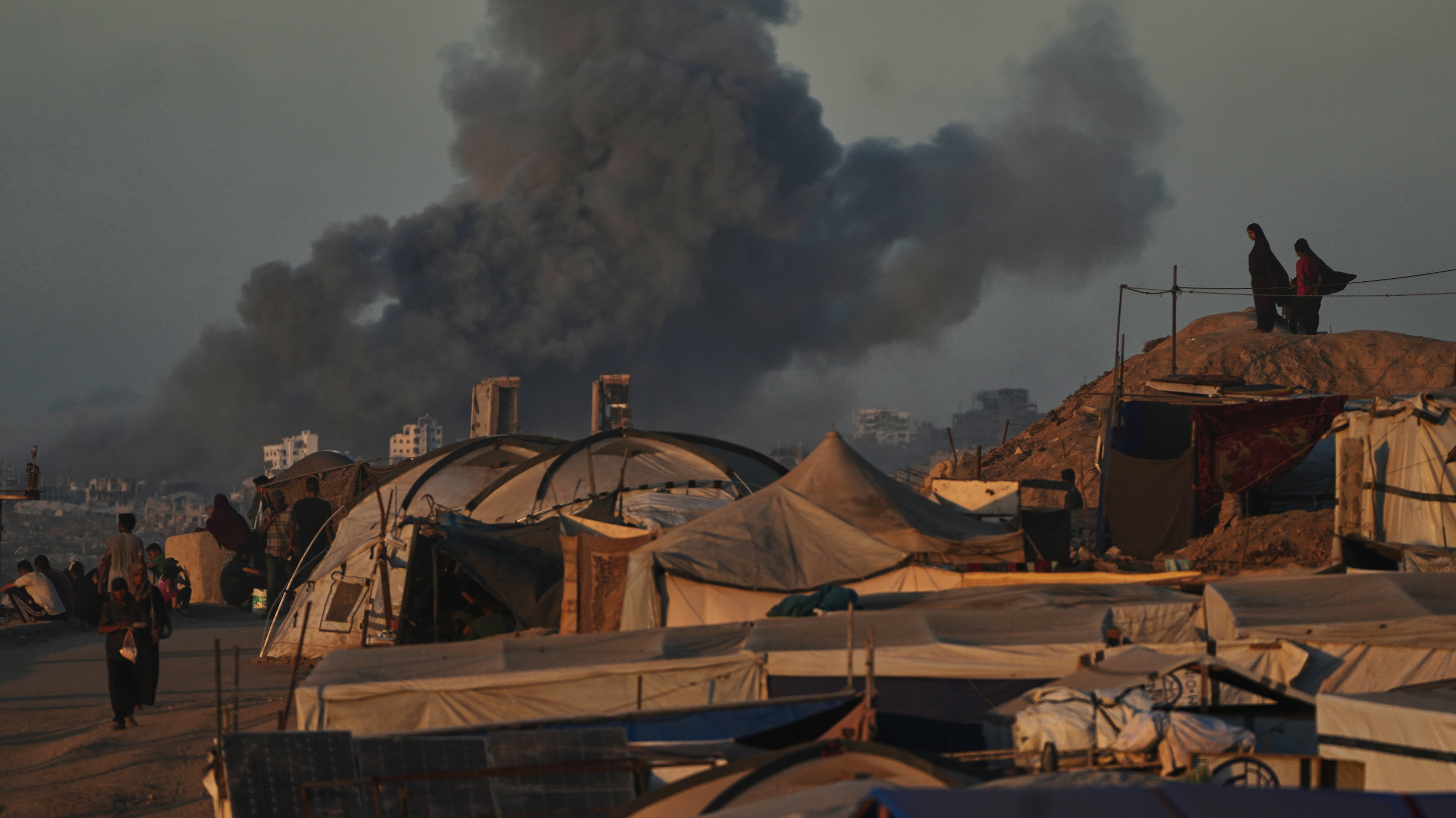 Smoke rises following an Israeli military strike in Gaza City, as seen from the central Gaza Strip, Wednesday, Oct, 1, 2025. (AP Photo/Abdel Kareem Hana)