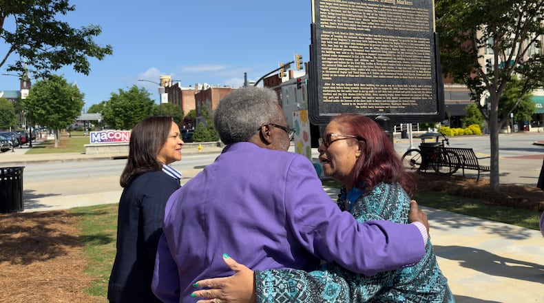 Muriel Jackson, right, embraces Alex Habersham during Monday's unveiling of one of three new Black history markers being installed in downtown Macon, Georgia on Monday, April 22, 2024. Jackson, head of the Genealogical and Historical Room and Middle Georgia Archives at the Washington Memorial Library, wrote the text for the markers.