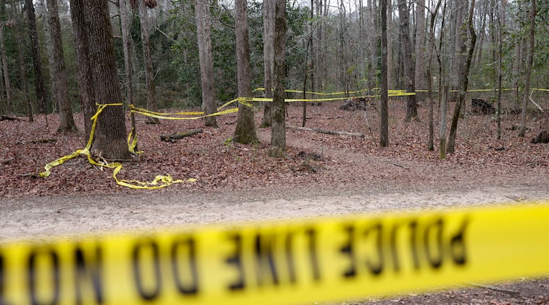 Police tape ropes off the crime scene after Laken Riley was killed on a trail behind Lake Herrick in Athens, Georgia, at the University of Georgia on Feb. 23, 2024. (Jason Getz/The Atlanta Journal-Constitution/TNS)