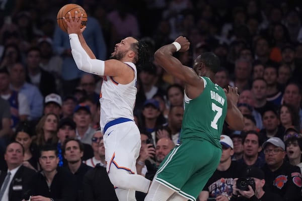New York Knicks' Jalen Brunson, left, drives past Boston Celtics' Jaylen Brown (7) during the second half of Game 6 in the Eastern Conference semifinals of the NBA basketball playoffs Friday, May 16, 2025, in New York. (AP Photo/Frank Franklin II)