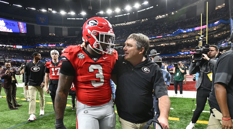 Georgia head coach Kirby Smart comforts Georgia linebacker CJ Allen as they leave after Ole Miss beat Georgia during the Sugar Bowl NCAA college football playoff quarterfinal game at the Caesars Superdome, Thursday, Jan. 1, 2026, in New Orleans. (Hyosub Shin/AJC)