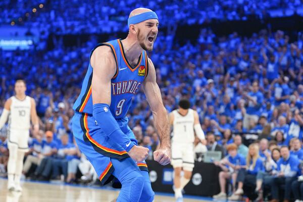Oklahoma City Thunder guard Alex Caruso celebrates during the first half in Game 1 of an NBA first-round playoff series against the Memphis Grizzlies, Tuesday, April 22, 2025, in Oklahoma City. (AP Photo/Kyle Phillips)