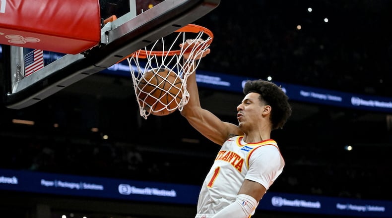 Hawks forward Jalen Johnson — pictured dunking during Game 6 against the Knicks last month — notched career-high averages in points (22.5), rebounds (10.3) and assists (7.9) this season. (Hyosub Shin/AJC)